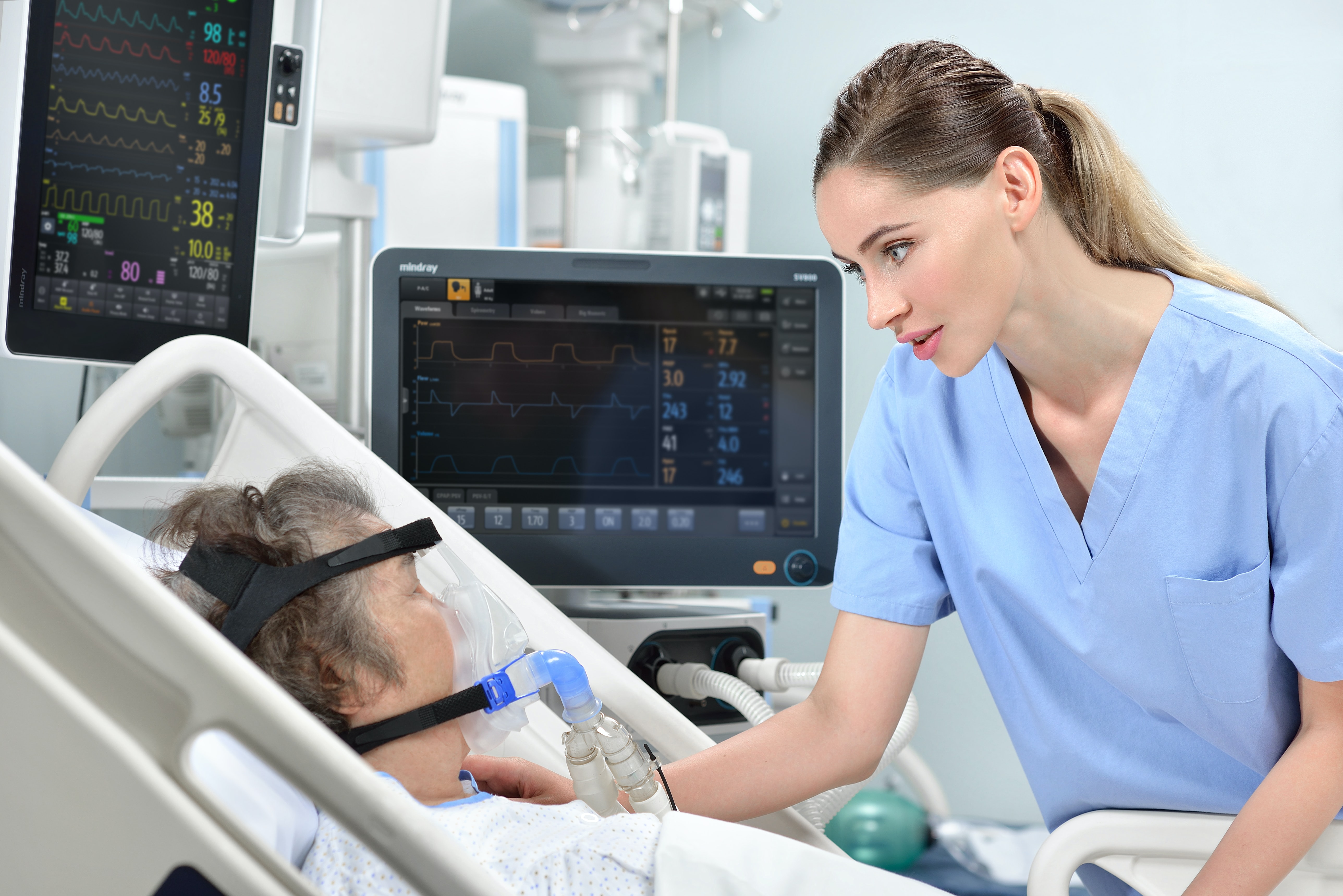 Doctor treating patient with breathing problem